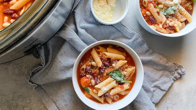 Bowl of minestrone with towel