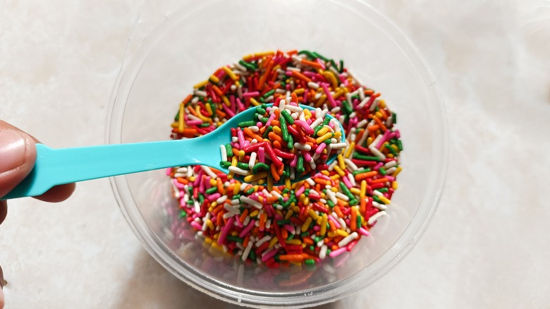 Bowl with sprinkles and spoon