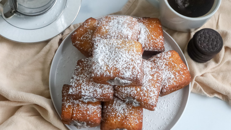 Disney-inspired cookies and cream beignets on a plate