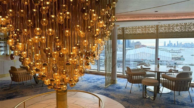 Champagne chandelier at the entrance to Enchanté onboard the Disney Treasure