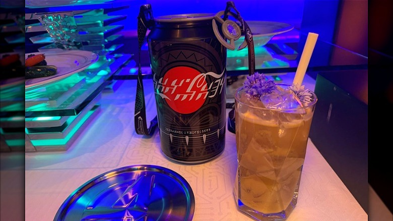 Drinks at Worlds of Marvel onboard the Disney Treasure: Ant Man Coke Can in Wakandan language, alongside a cocktail