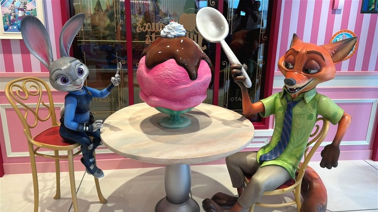 Zootopia characters eating an ice cream sundae at Jumbeaux's Sweets onboard the Disney Treasure