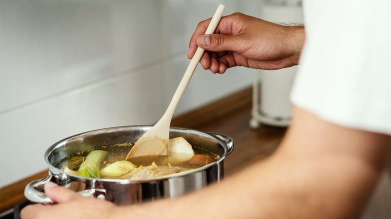 cooking soup with vegetables