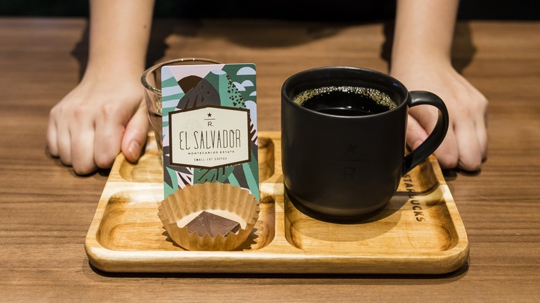 Starbucks coffee in ceramic mug on tray