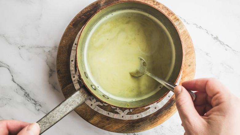 green milk in saucepan