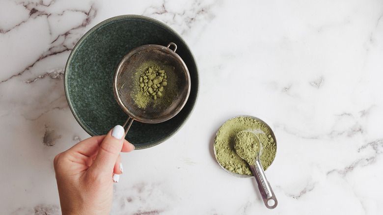 sifting matcha powder