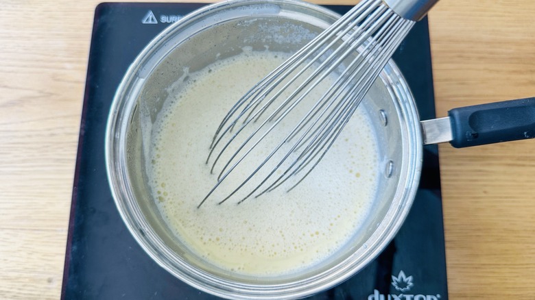 sugar and milk in saucepan