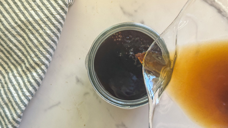 Pouring coffee into clean jar