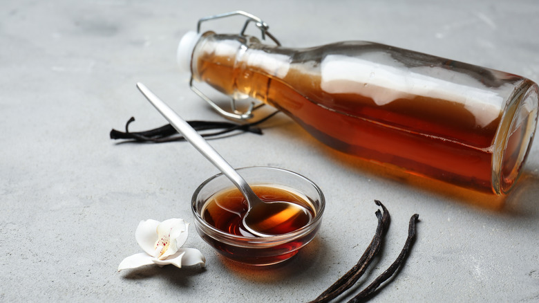 vanilla extract in bowl and bottle