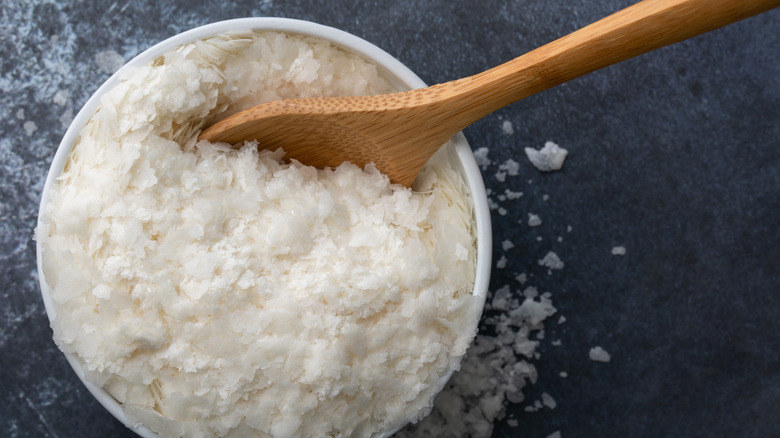 Bowl of potato flakes with wooden spoon