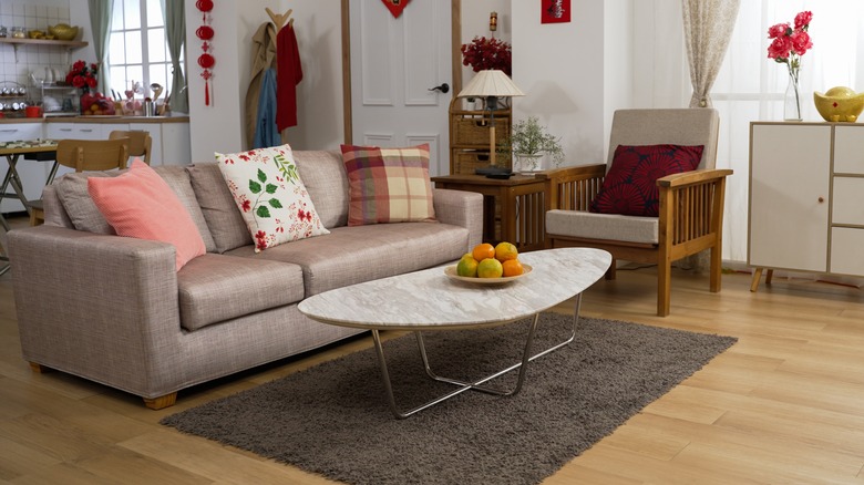 Wooden coffee table in front of couch