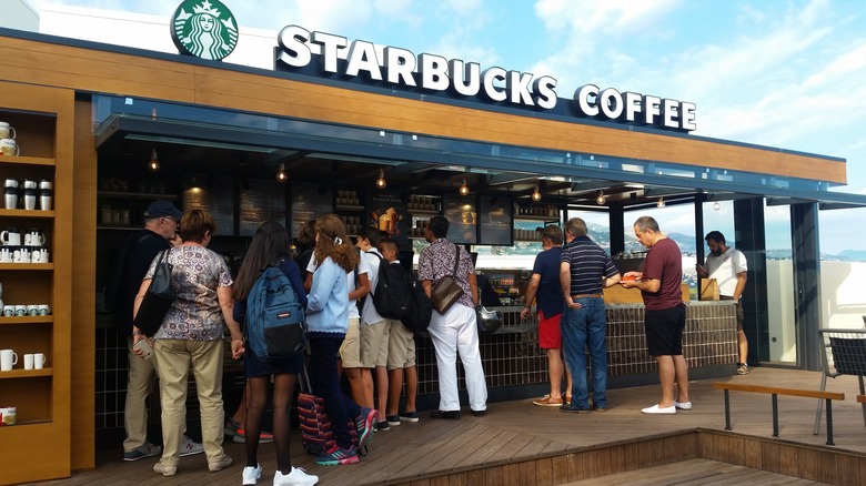 Customers lined up at a busy Starbucks store