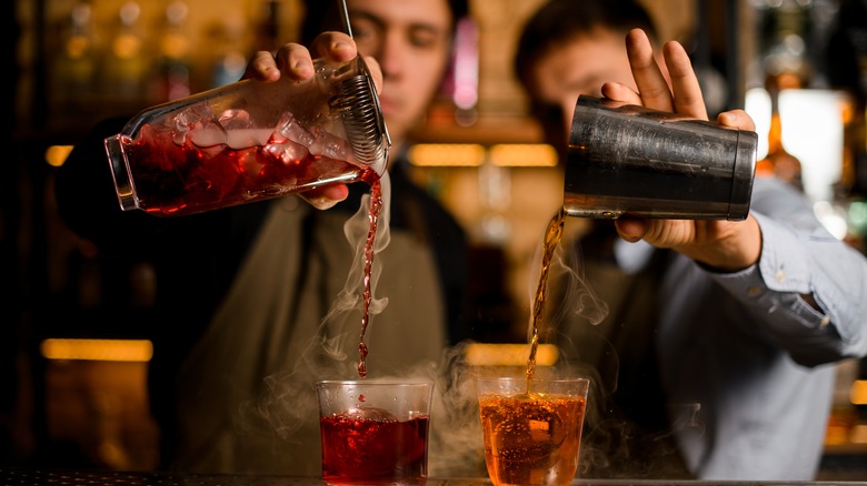 Bartenders mixing cocktails