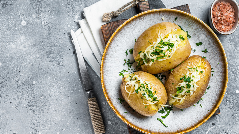 Baked potatoes with cheese and herbs