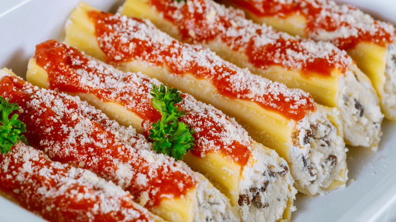 Stuffed manicotti with sauce and parmesan