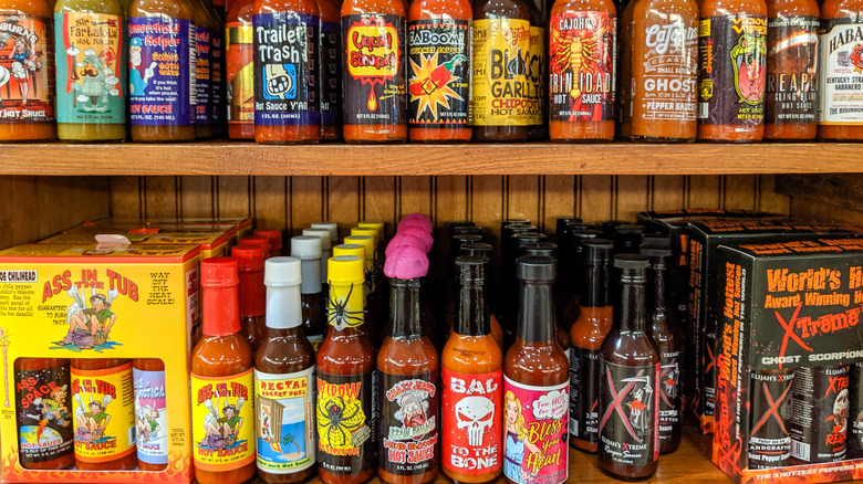 shelf of novelty hot sauces