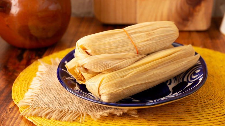 chicken tamales on blue and white plate