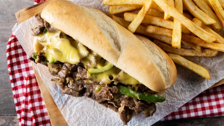 A Philly cheesesteak with a side of fries