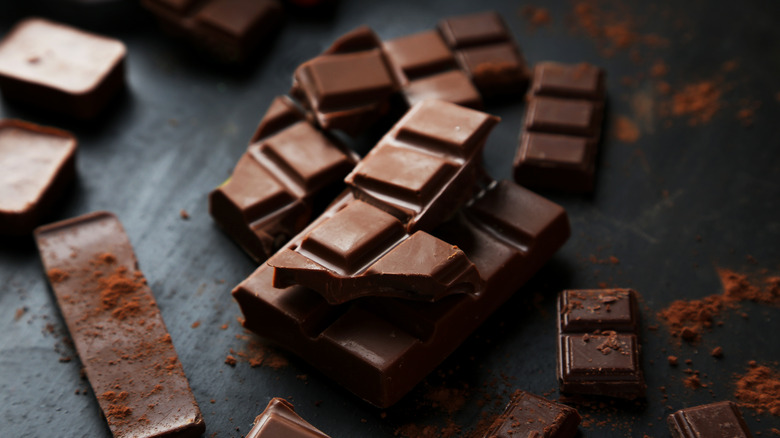 Broken chocolate on black counter