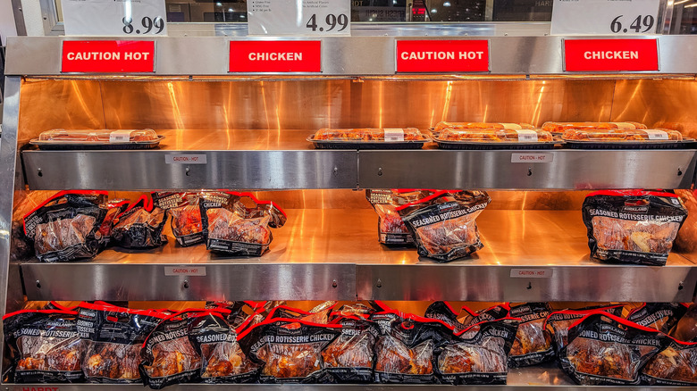 Over a dozen Costco rotisserie chickens on the shelf