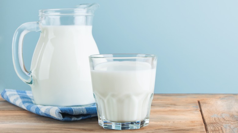 glass and pitcher of milk