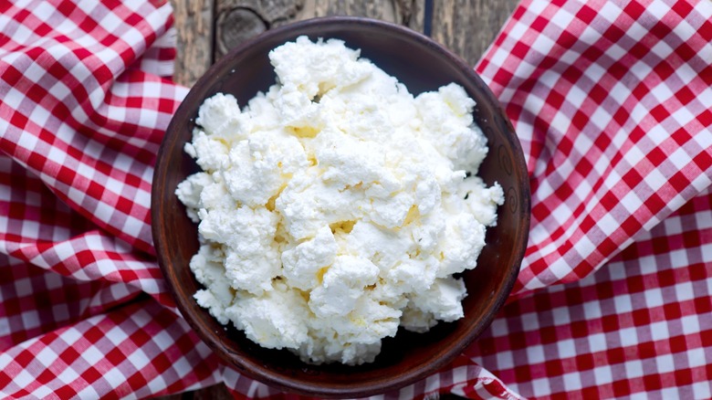 Overhead view of cottage cheese on tablecloth