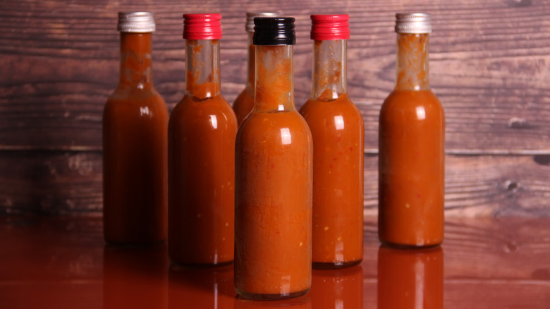 bottles of different flavors of hot sauce