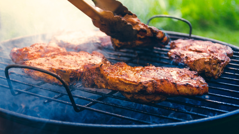 smoky meat on a grill 