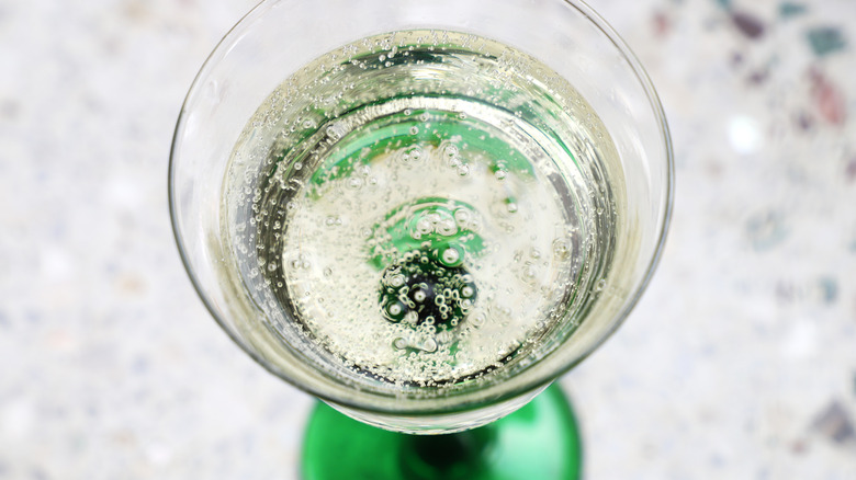 Glass of sparkling wine with visible bubbles 