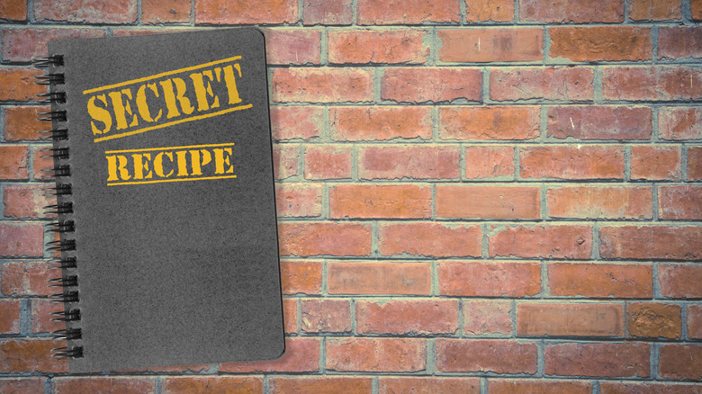 Secret recipe book against brick