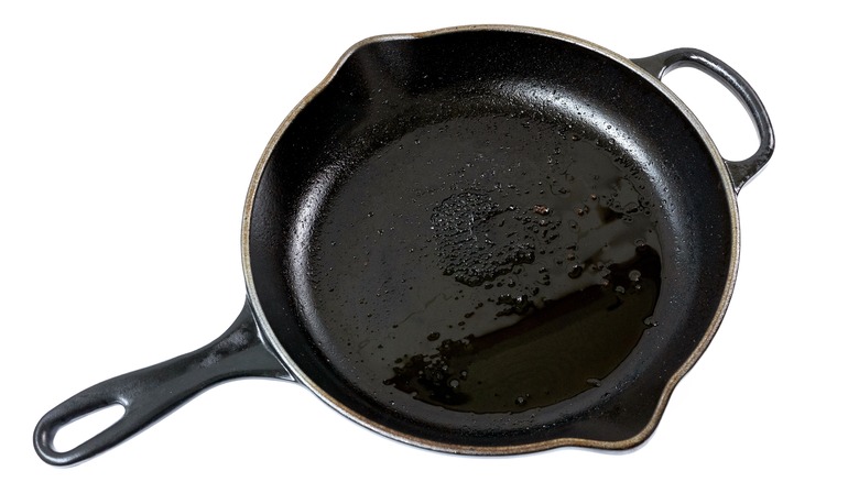 cast iron skillet with oil