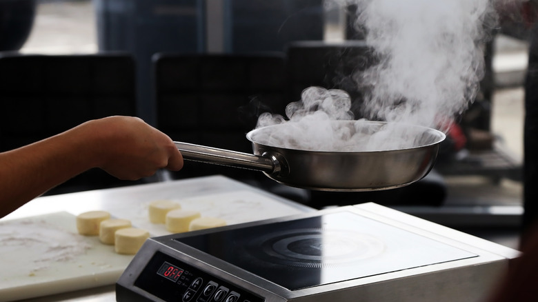 A smoking pan on the stove