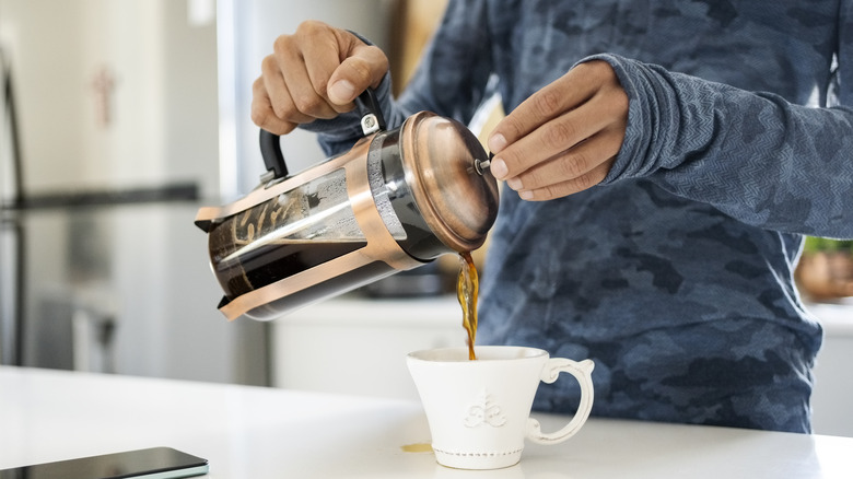 pouring French press coffee