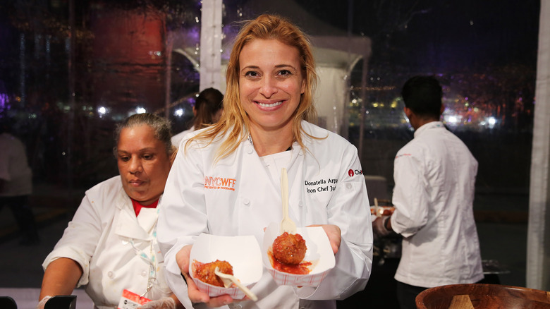 Donatella Arpaia smiling and holding meatballs