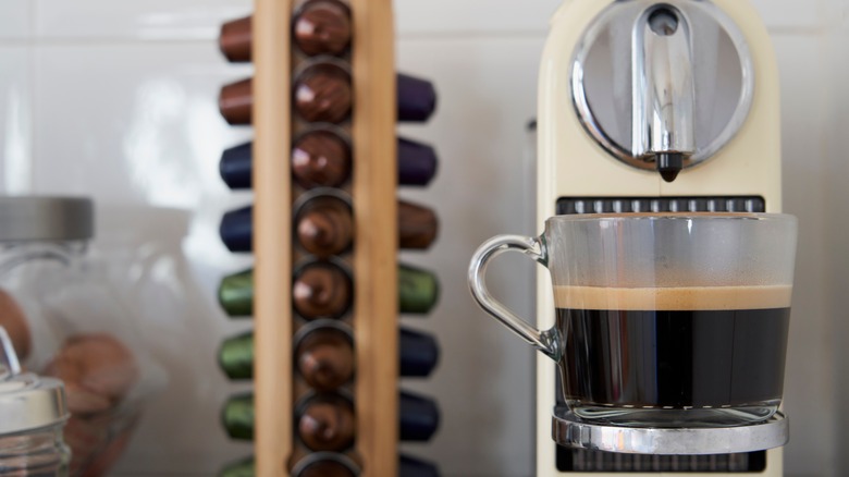 close up of coffee machine with Nespresso pods