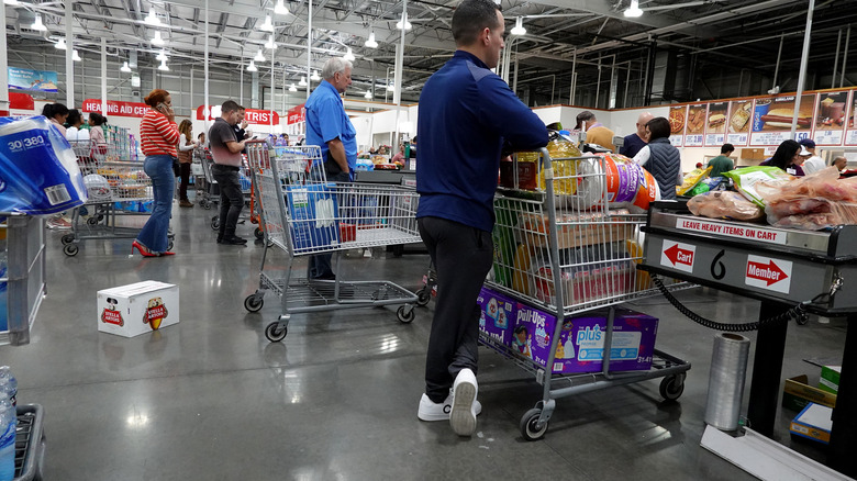 Customers in line to check out at Costco