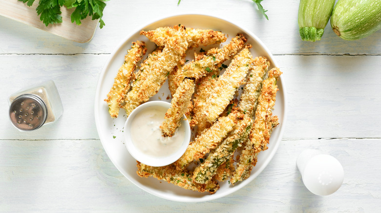 bowl of zucchini fries with dipping sauce