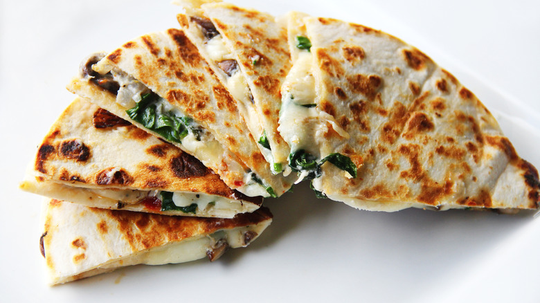 spinach quesadillas on a white background