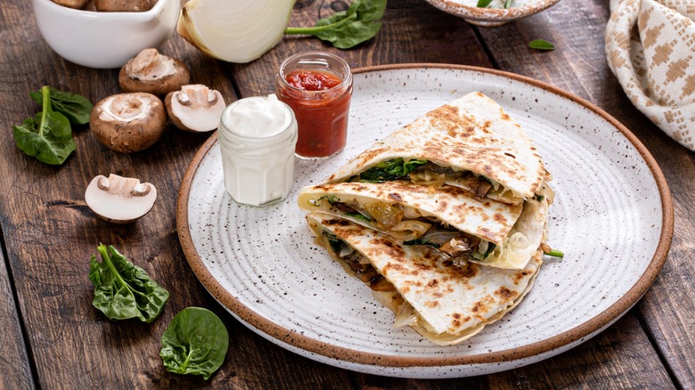 spinach and mushroom quesadilla on a plate