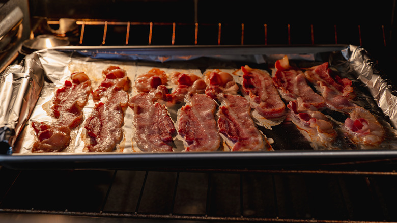 sheet pan of bacon in the oven