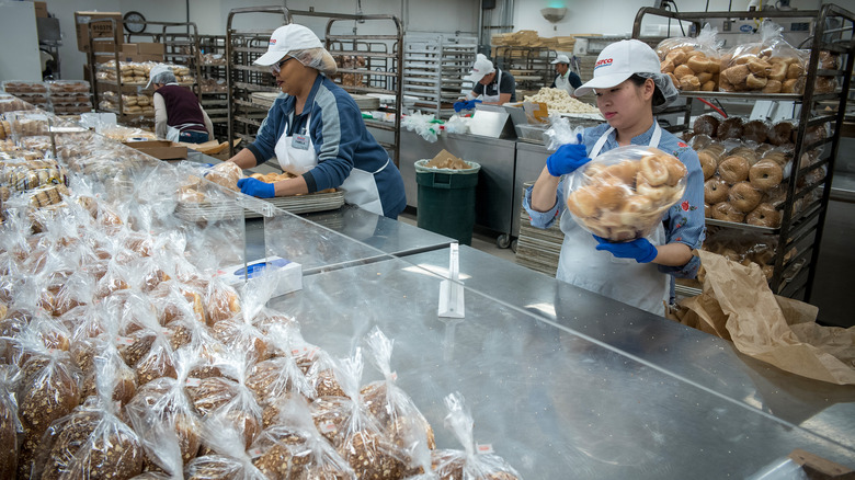 Costco employees preparing baked goods