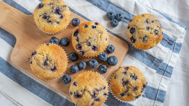 Blueberry muffins on a board