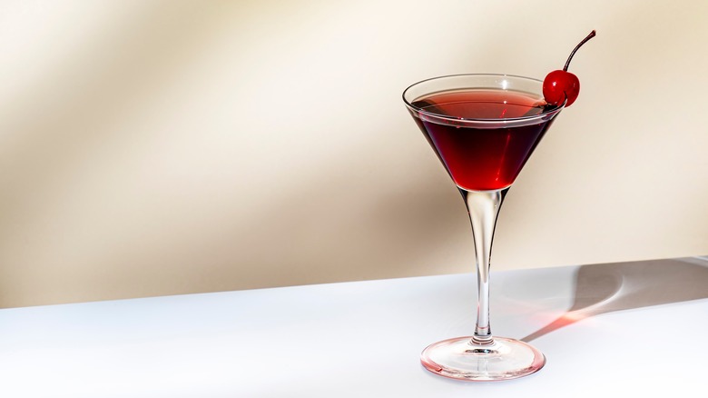 Cocktail with cherry garnish