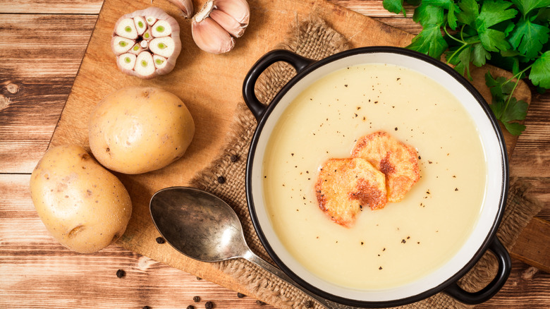 potato chips over creamy potato soup 