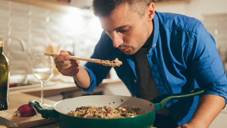 cook tasting risotto