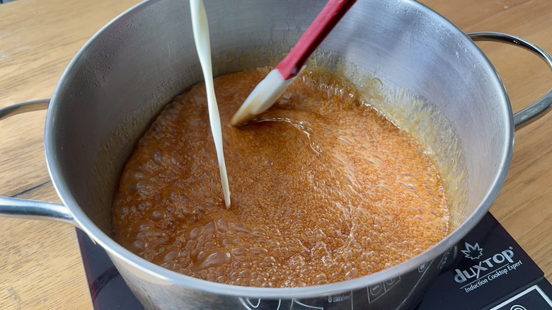 cream pouring into caramel