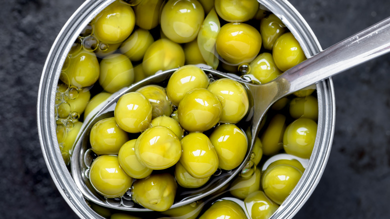 Canned peas with spoon