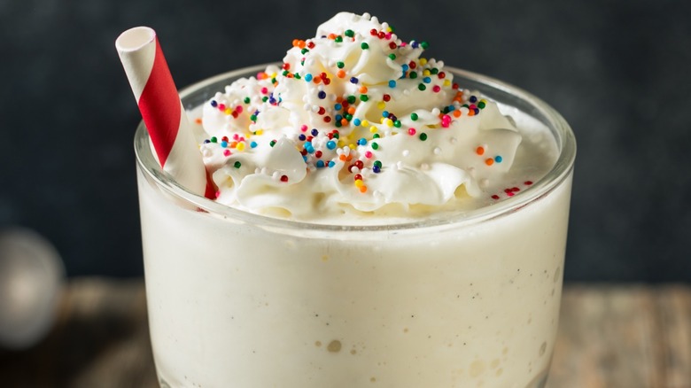 Close-up of milkshake with rainbow sprinkles 