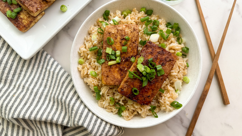 dubu jorim over rice with chopsticks