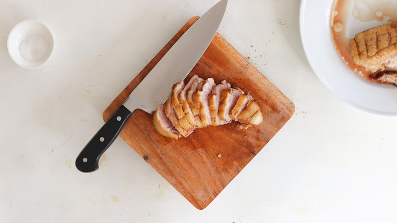 duck breast sliced on cutting board